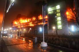 Ground level view of an intense fire burning inside a parking garage at King’s Dock, Liverpool, United Kingdom, in 2017.