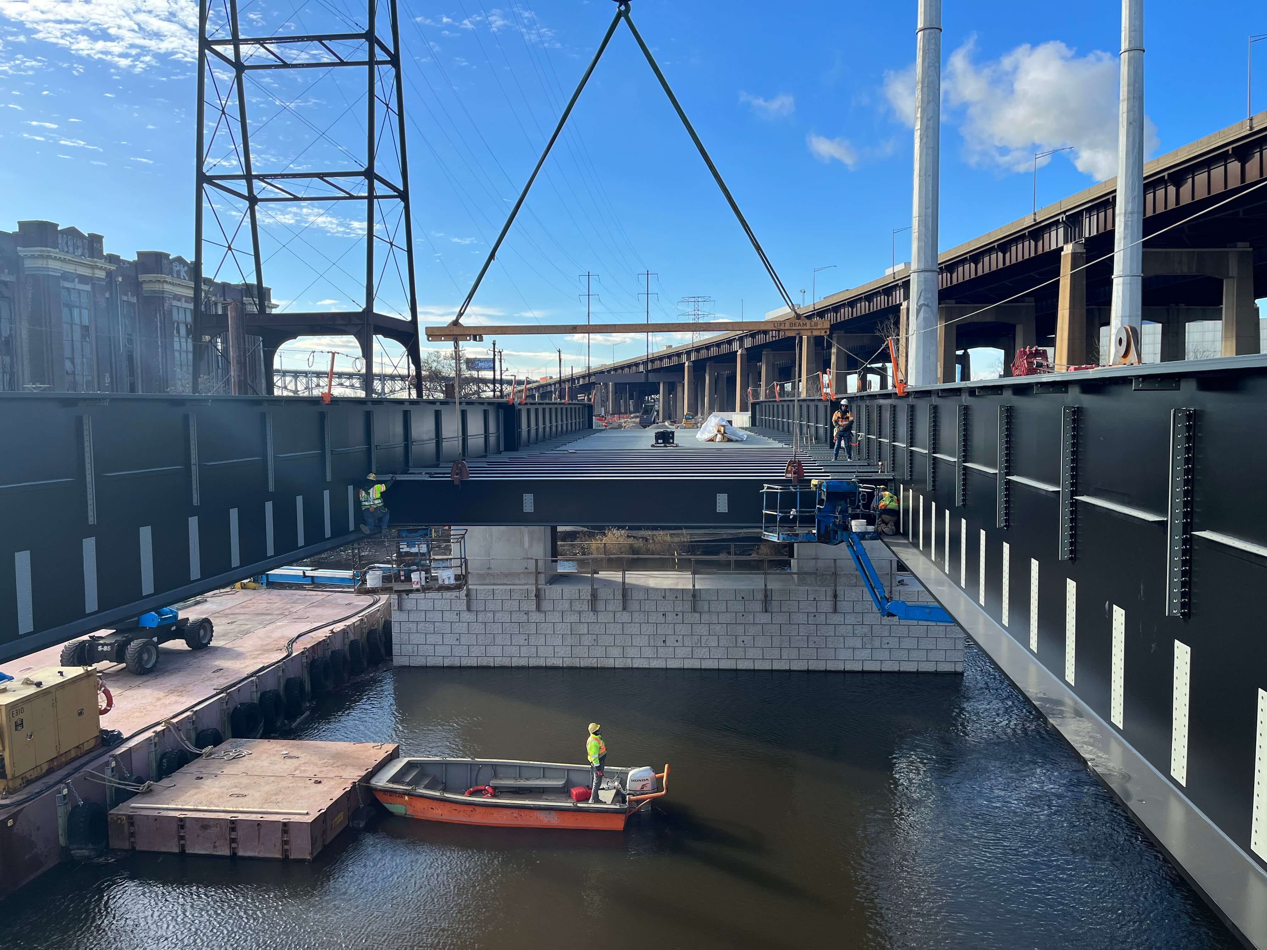 Construction crews install the floor beams of the new Point-no-Point railroad bridge in Newark, New Jersey.